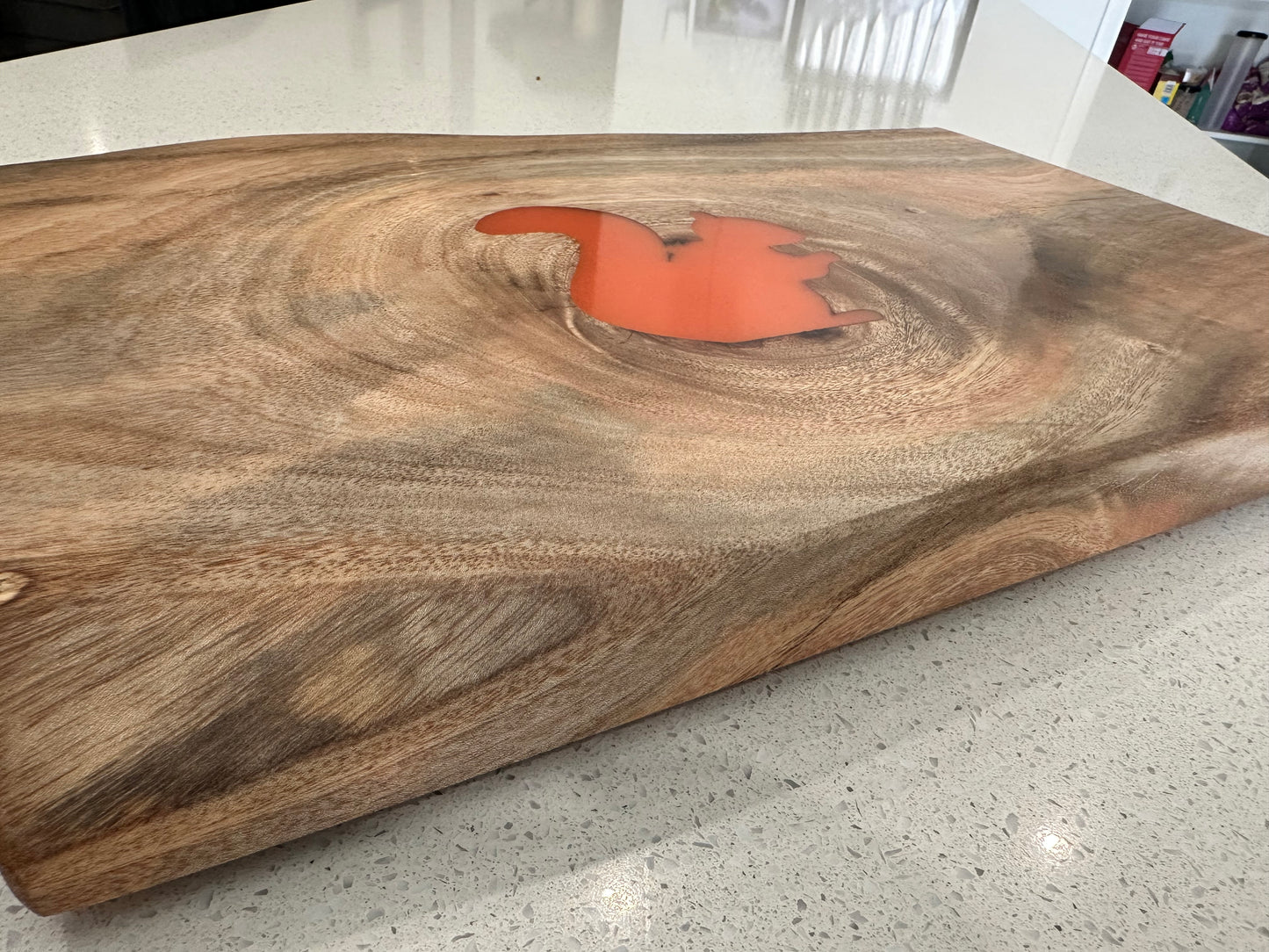 Resin squirrel inlay detail on handmade hardwood charcuterie board