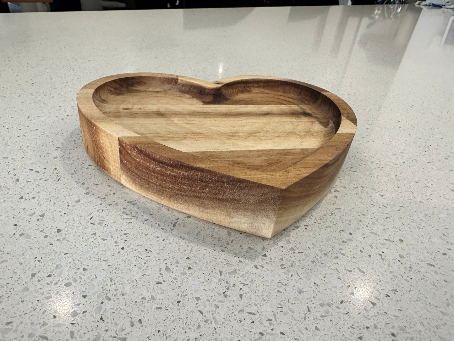 Acacia wood grain detail on heart shaped wooden jewellery tray