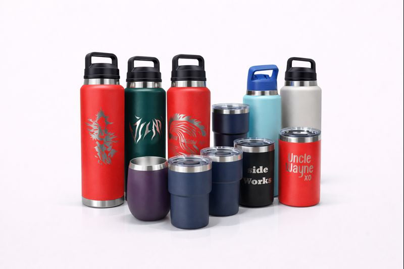 Assortment of custom‑engraved YETI‑style bottles and tumblers in various colours and designs.