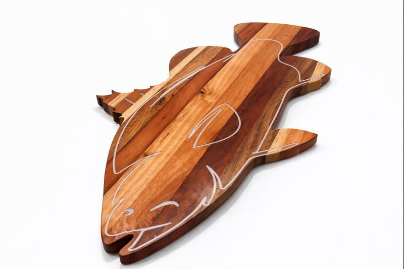 Fish‑shaped wooden serving board featuring carved compartments.