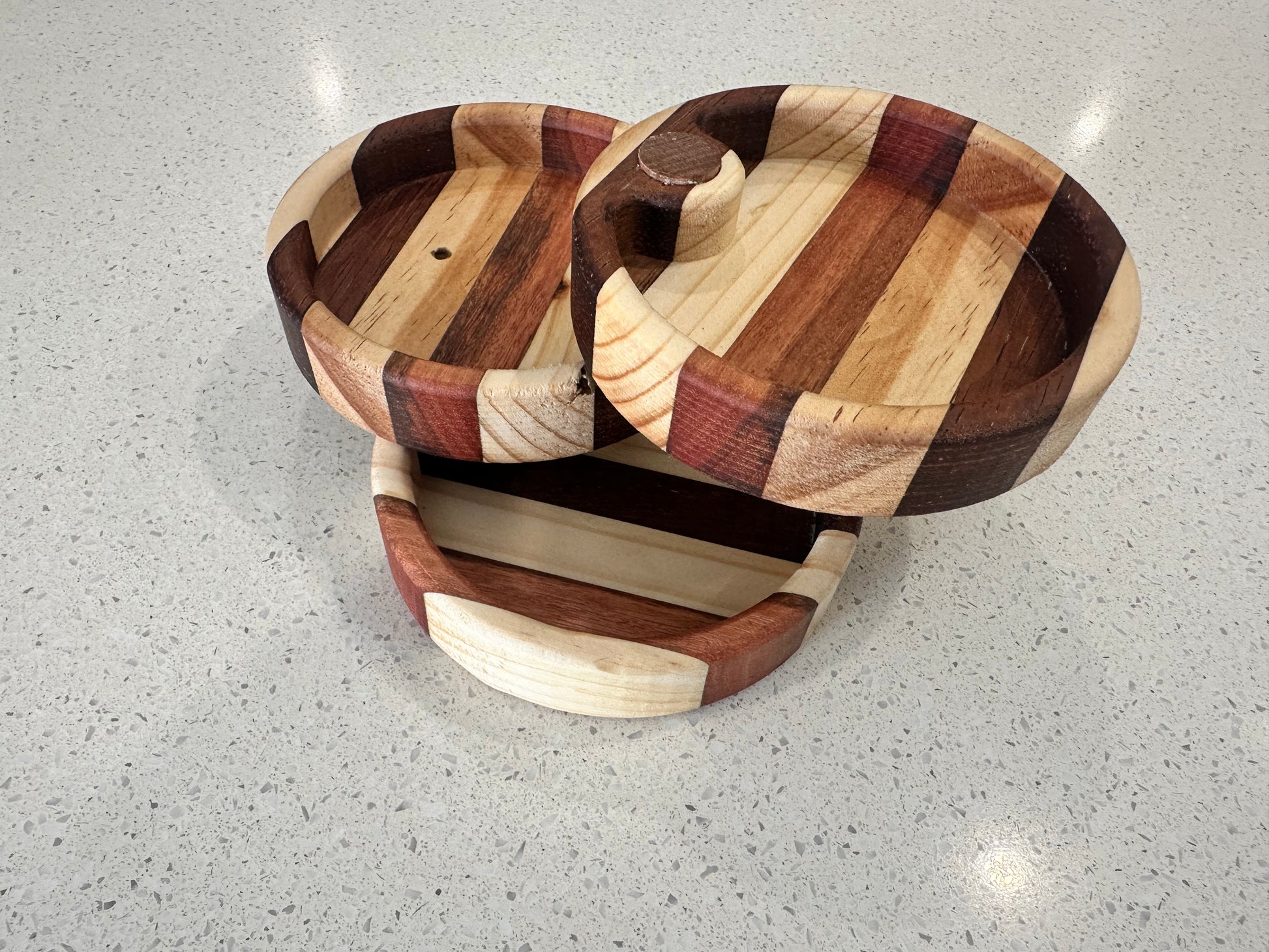 Three tier fold out wooden jewellery holder showing jewellery storage trays