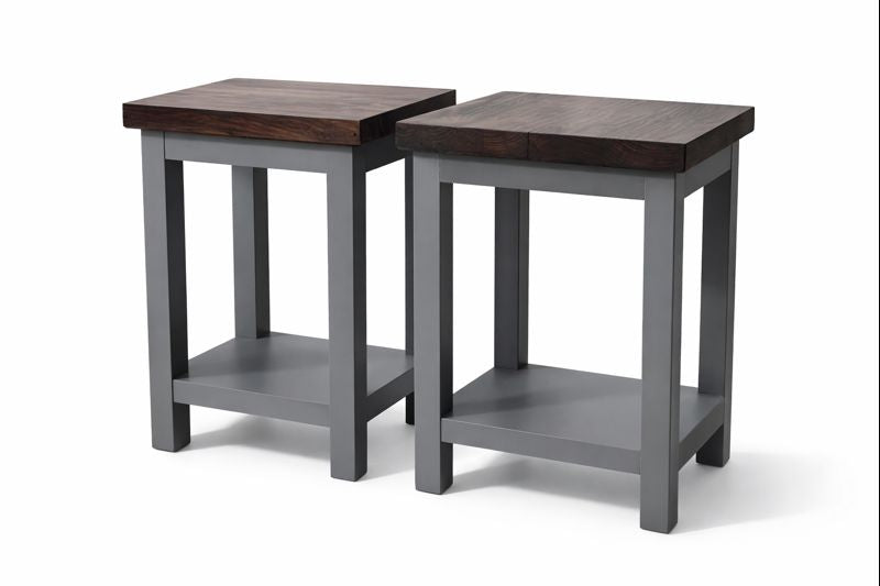 Grey painted side tables with dark wooden tops and lower shelves.