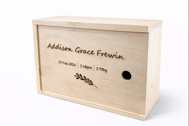 Personalised wooden keepsake box with sliding lid engraved with baby name and birth details.