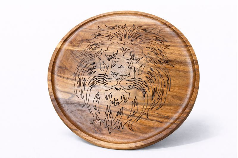 Round wooden platter featuring a detailed laser‑engraved lion head design.