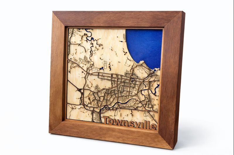 Wooden map of Townsville framed with blue resin representing water.