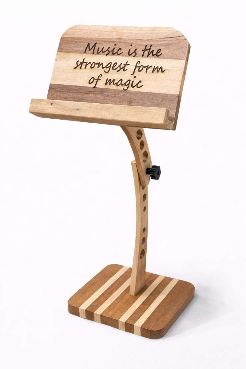 Custom adjustable wooden music stand engraved with the quote “Music is the strongest form of magic.”