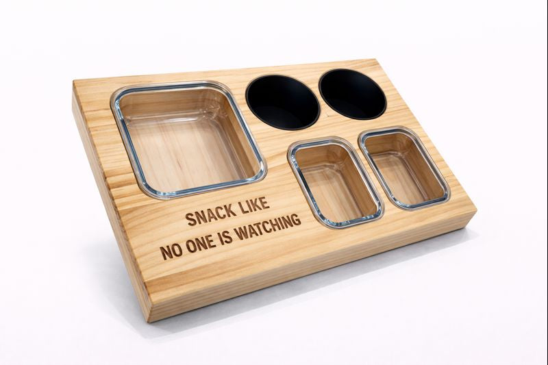 Wooden snack board with multiple compartments and the phrase “Snack like no one is watching” engraved.